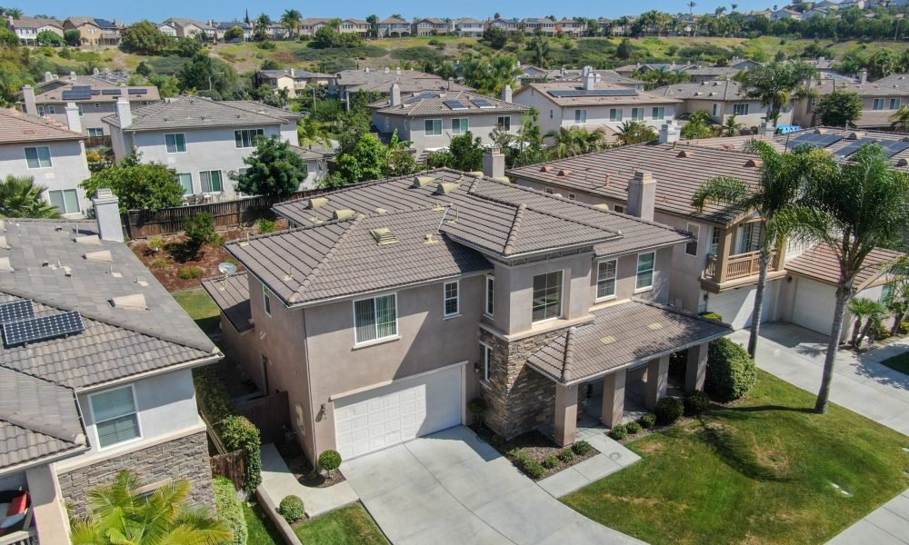 Suburban neighborhood street with big villas next to each other in Black Mountain, San Diego, California, USA. Aerial view of residential modern subdivision luxury house.